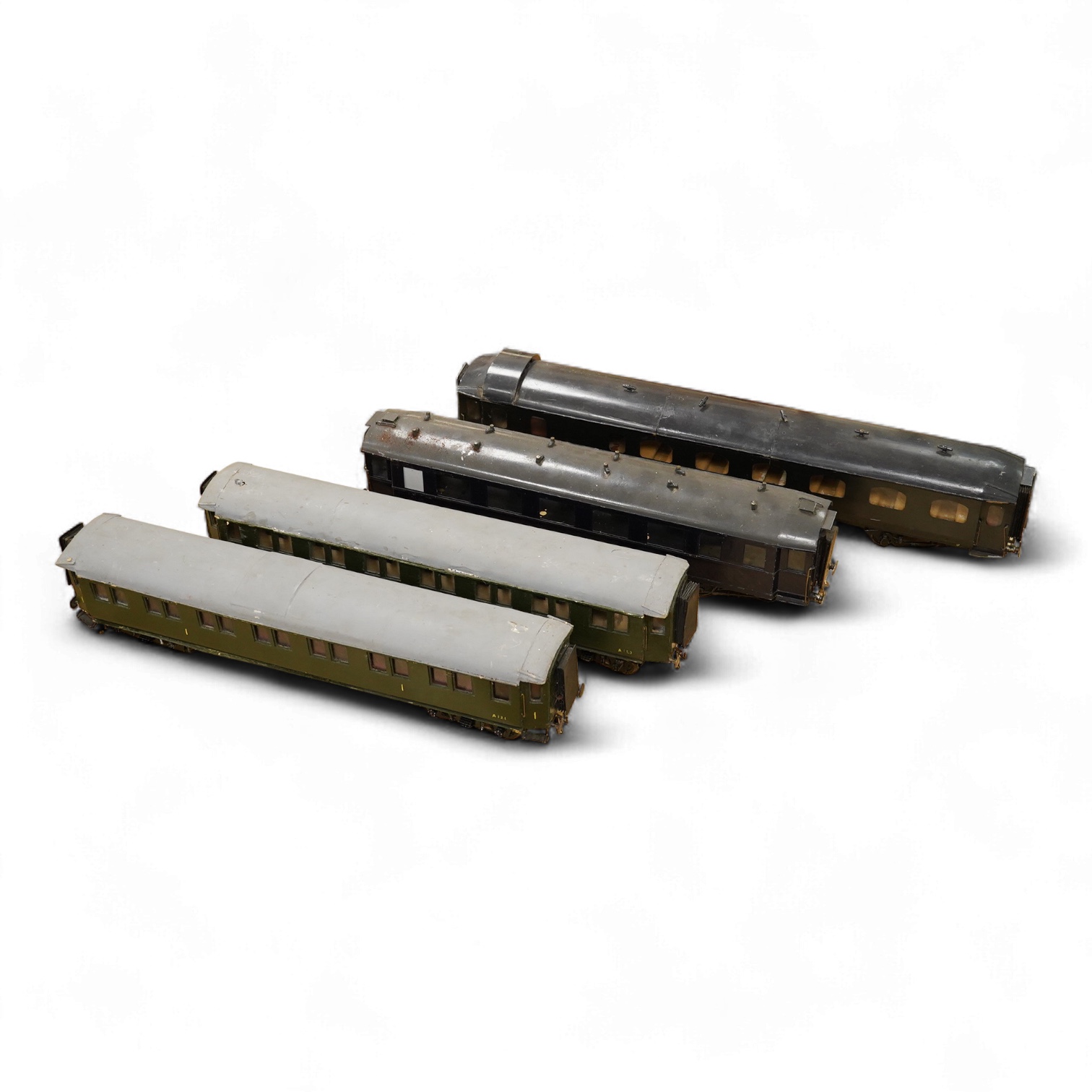 Four Gauge One Continental bogie coaches; two in very dark Green livery, and two ‘Trains Rapides Nord’ in dark green, including some scratch building and possible adaptation from kits